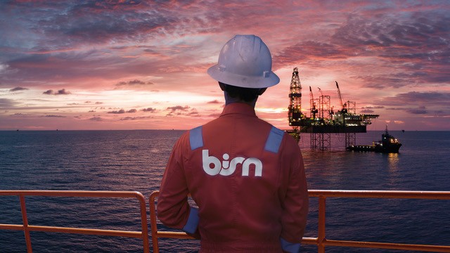 A-BiSN-sunset-image-crewmember-in-foreground-rig-in-distance.jpeg